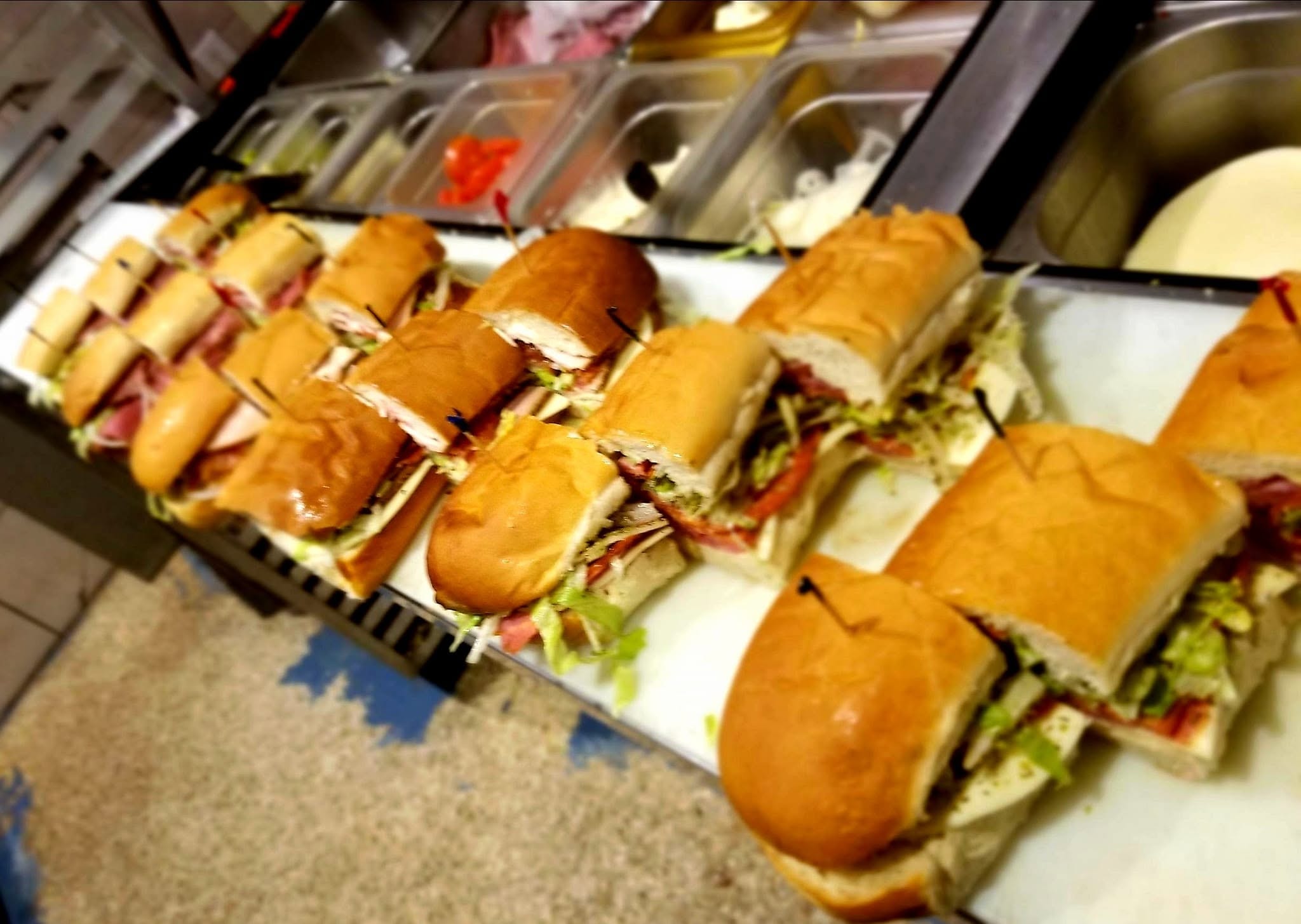 Fresh-made subs lined up in the kitchen at Stus Surfside Subs